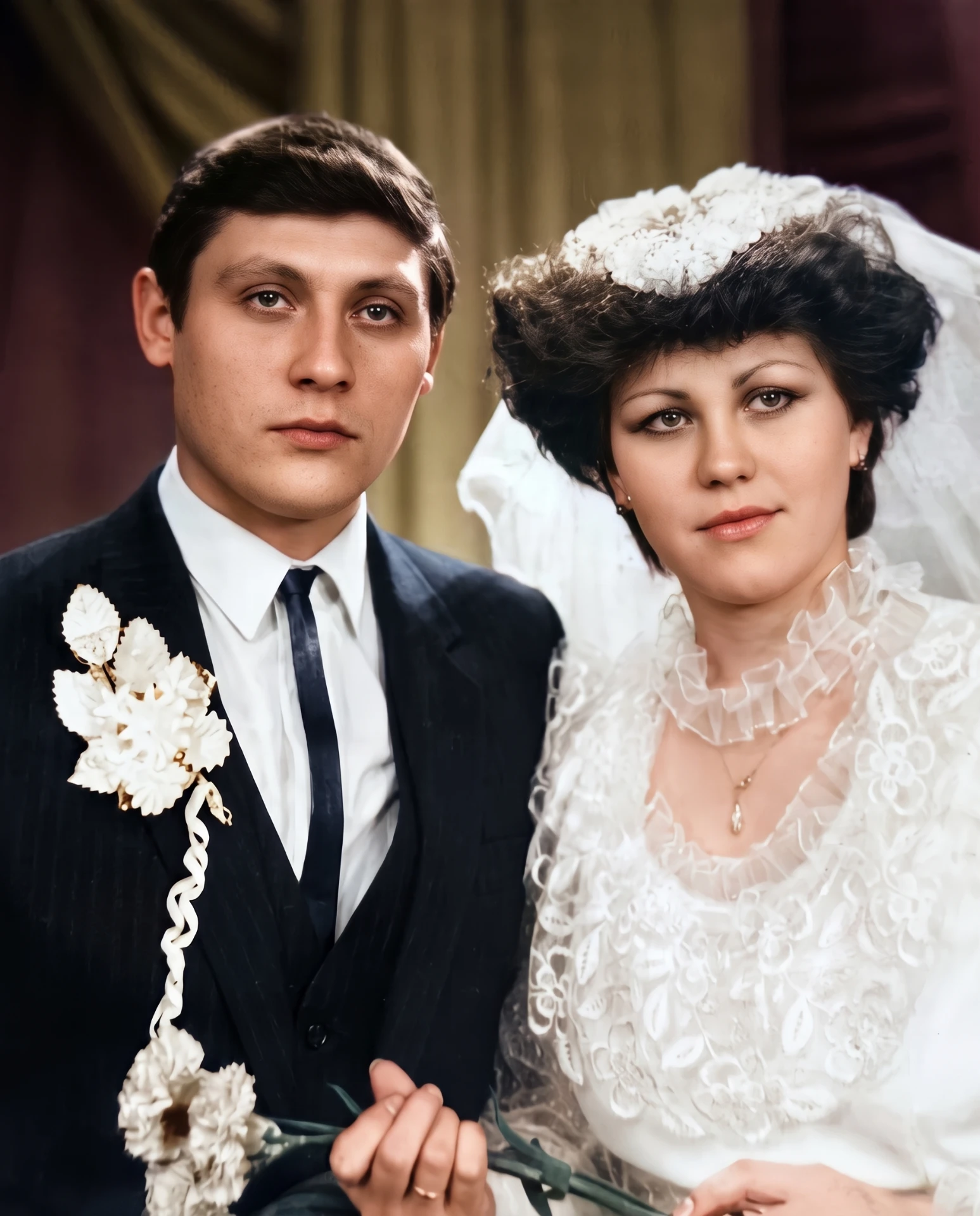 Restored and colourised wedding portrait of a bride in lace and a groom with a carnation boutonnière